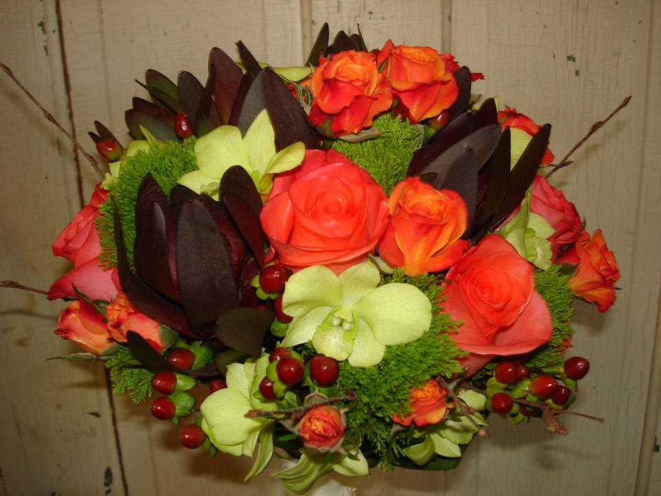 This bouquet also includes honeycolored chrysanthemums and rustic red sedum