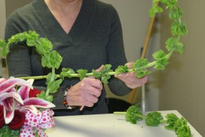 Regina cuts the flowers for freshness and ease of insertion.