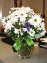Bouquet of white chrysanthemums and blue statice.