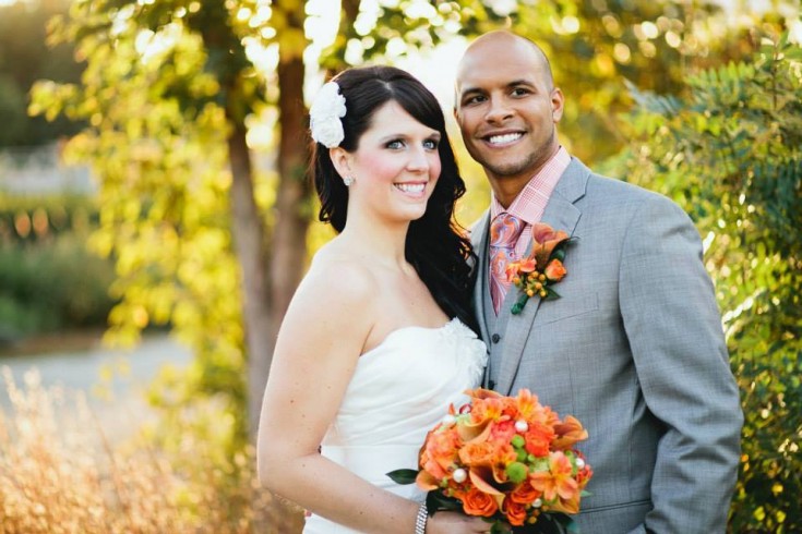 Lovely bouquet and boutonniere from Clarabella Flowers in Clare, MI