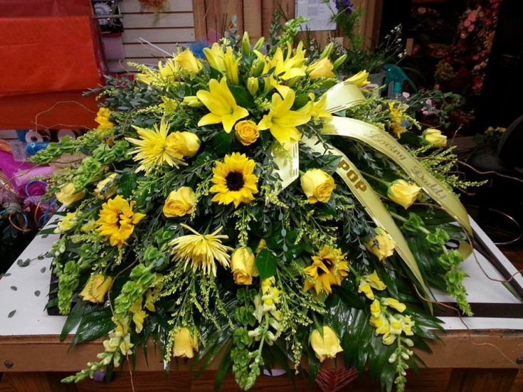 An amazing casket spray from Carthage Flower Shop in Carthage, TX