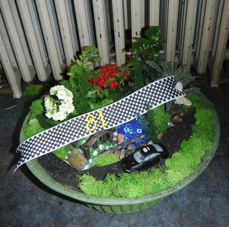 Miniature garden with racecar theme from Crow River Floral and Gifts in Hutchinson, MN