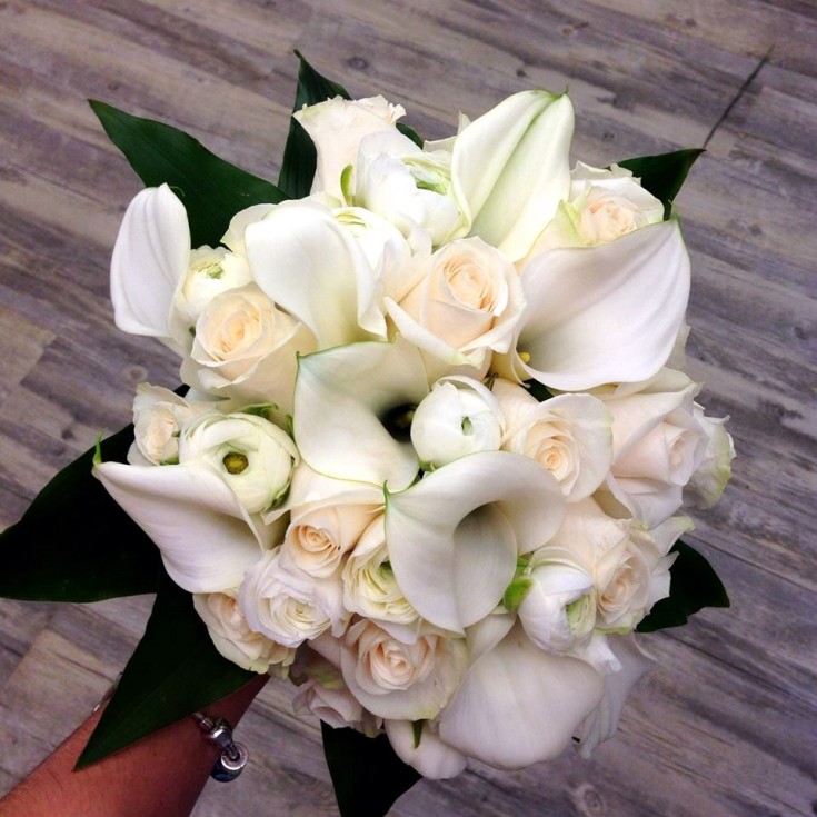An elegant white wedding bouquet from Petals in Thyme of Wasaga Beach, ON