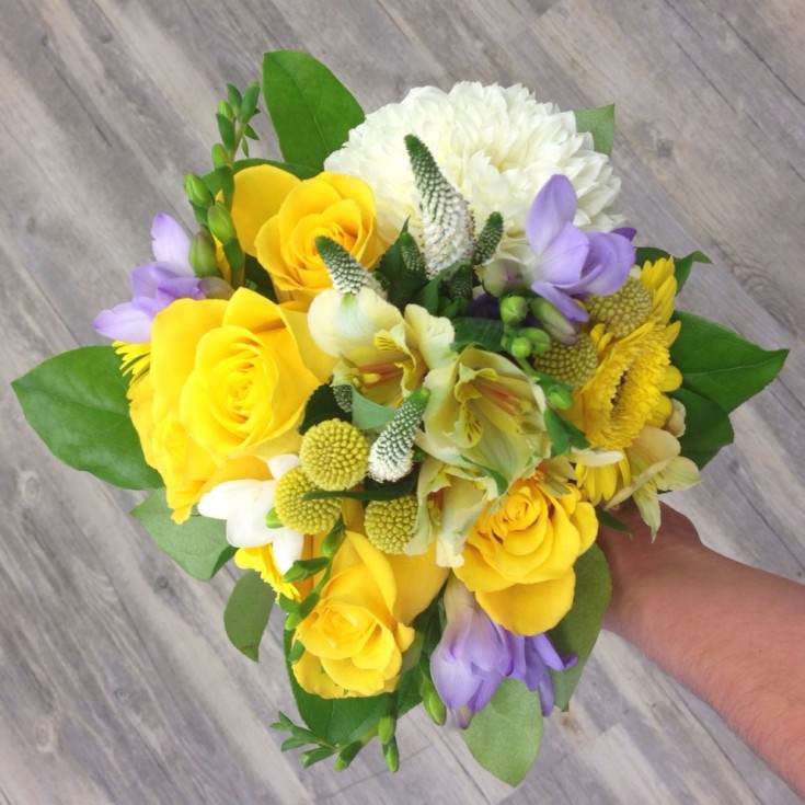 Explosively colorful bridesmaid bouquet from Petals in Thyme of Wasaga Beach, ON